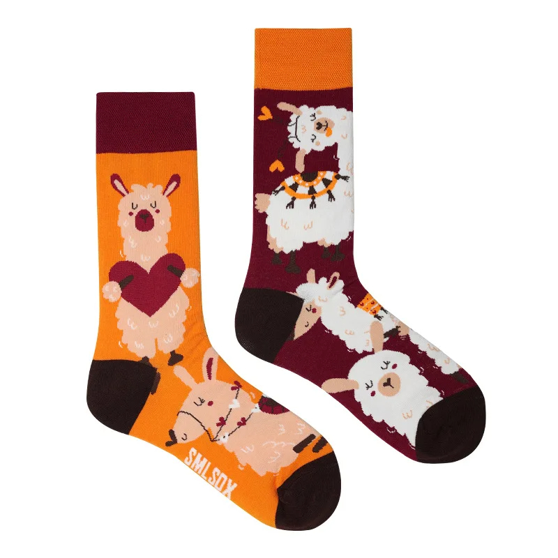 Two socks with animal designs on an orange and purple background