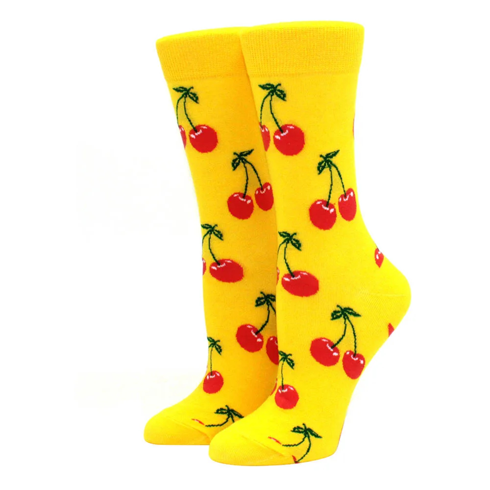 Yellow socks with red cherry pattern on a white background