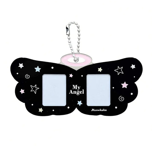 Black butterfly-shaped keychain with 'My Angel' text and star designs on a white background