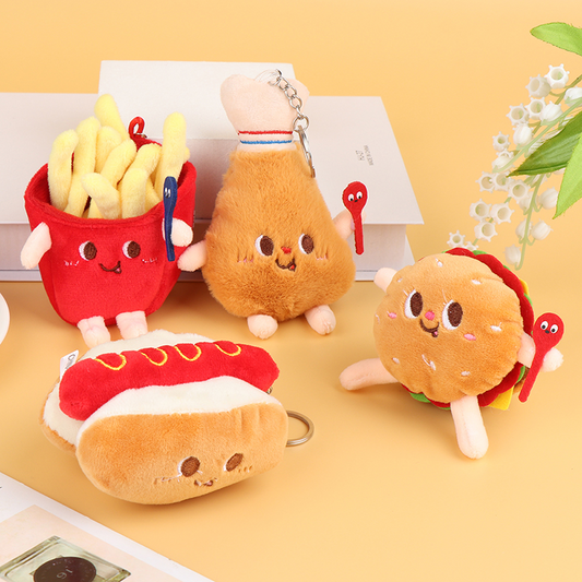 A collection of soft plush keychains in the shapes of junk food items, including a burger and a hot dog, with cute facial features.