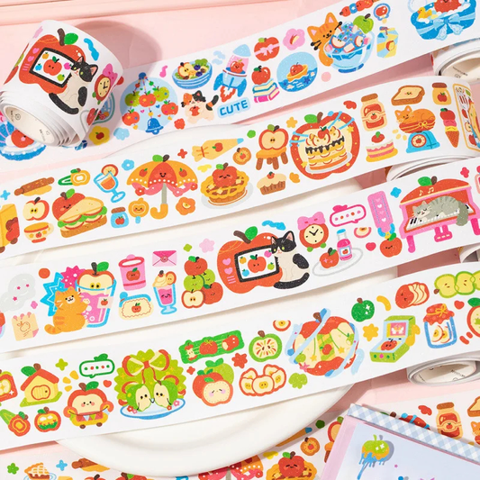 Colorful washi tape rolls with cute designs on a pink background