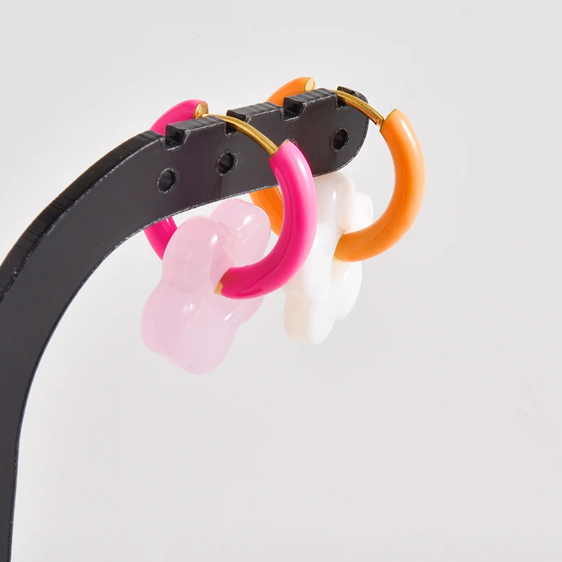 Colorful hoop earrings on a white background