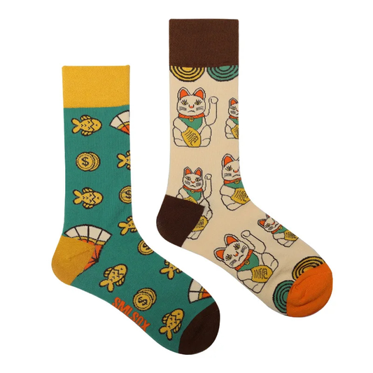 Two socks with cat and dollar sign patterns on a white background