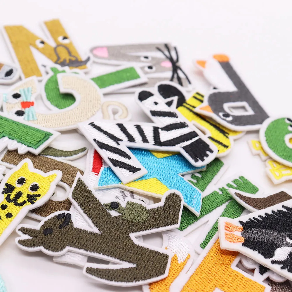 Collection of colorful embroidered patches with various designs on a white background