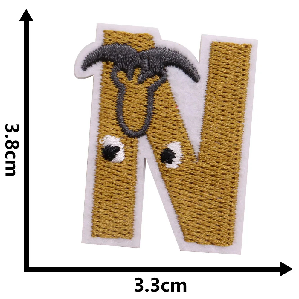 Embroidered patch of a letter 'N' with measurements on a white background