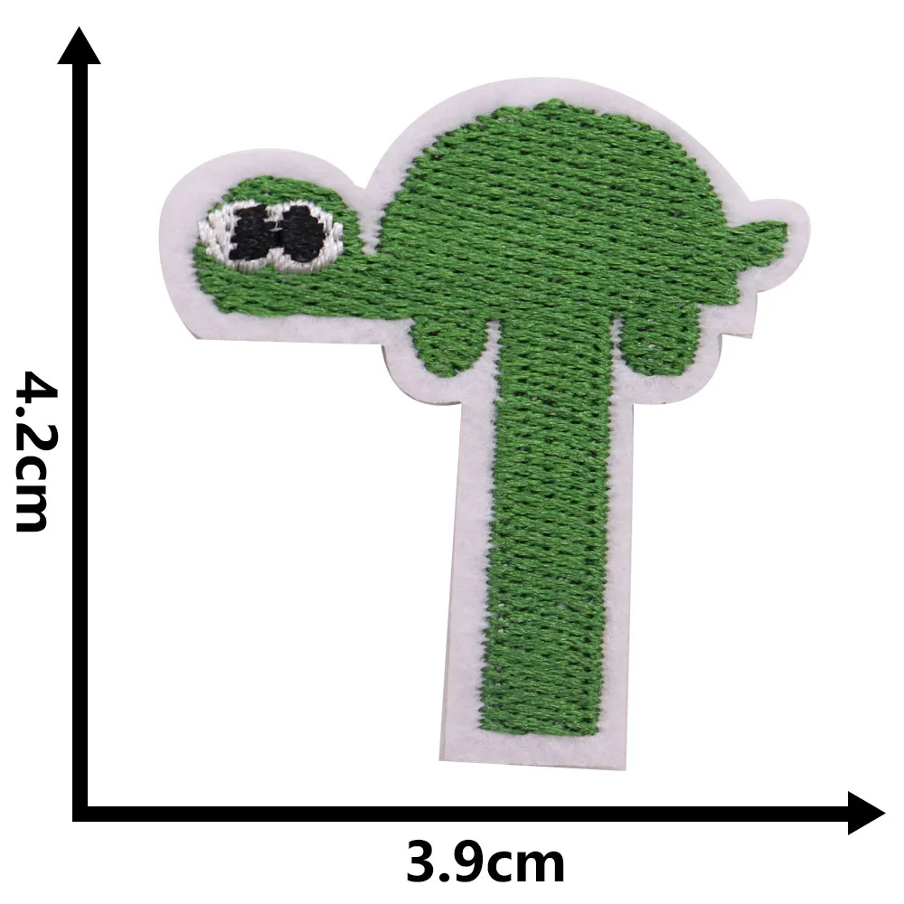 Green turtle-shaped patch with measurements on a white background