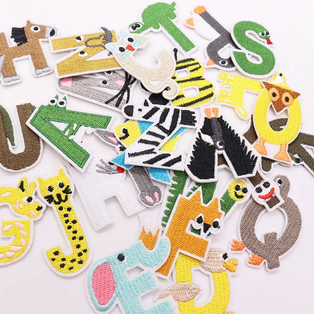 Collection of colorful animal-themed letter patches on a white background