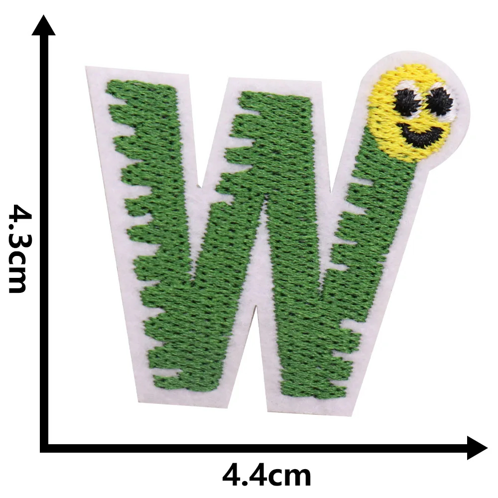 Embroidered patch with a green letter 'W' and a smiling yellow worm face on a white background, with measurements indicated.