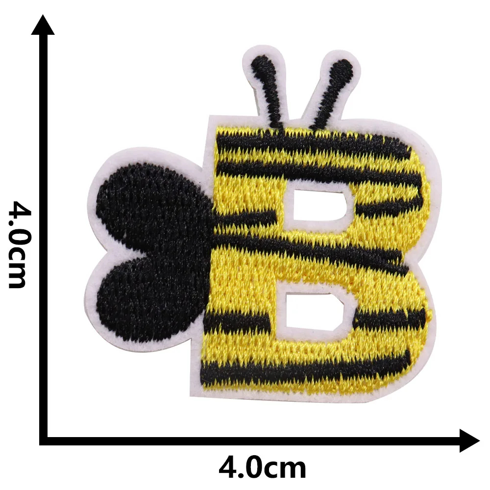 Bee-shaped patch with letter 'B' on a white background