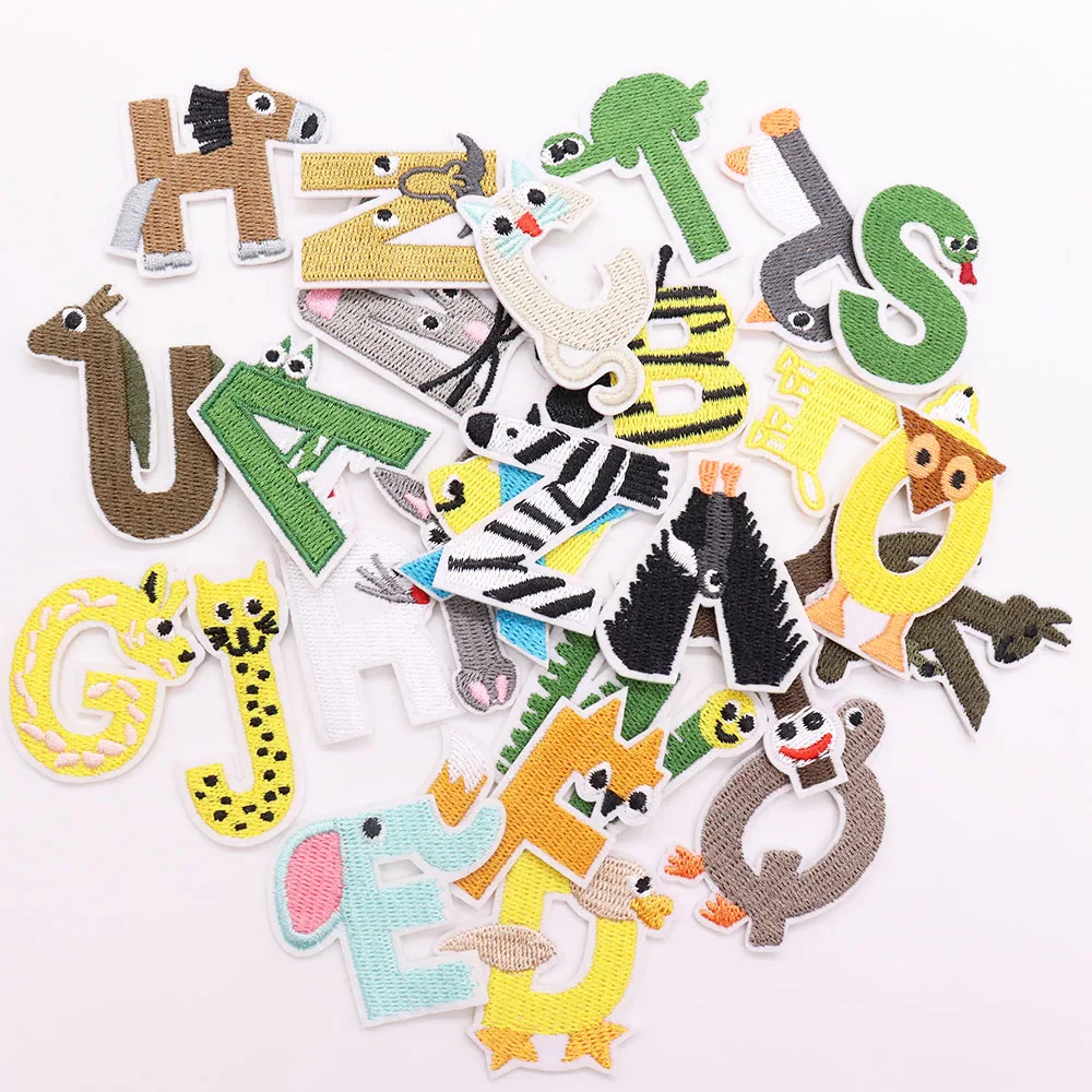 Assorted animal-themed letter patches on a white background