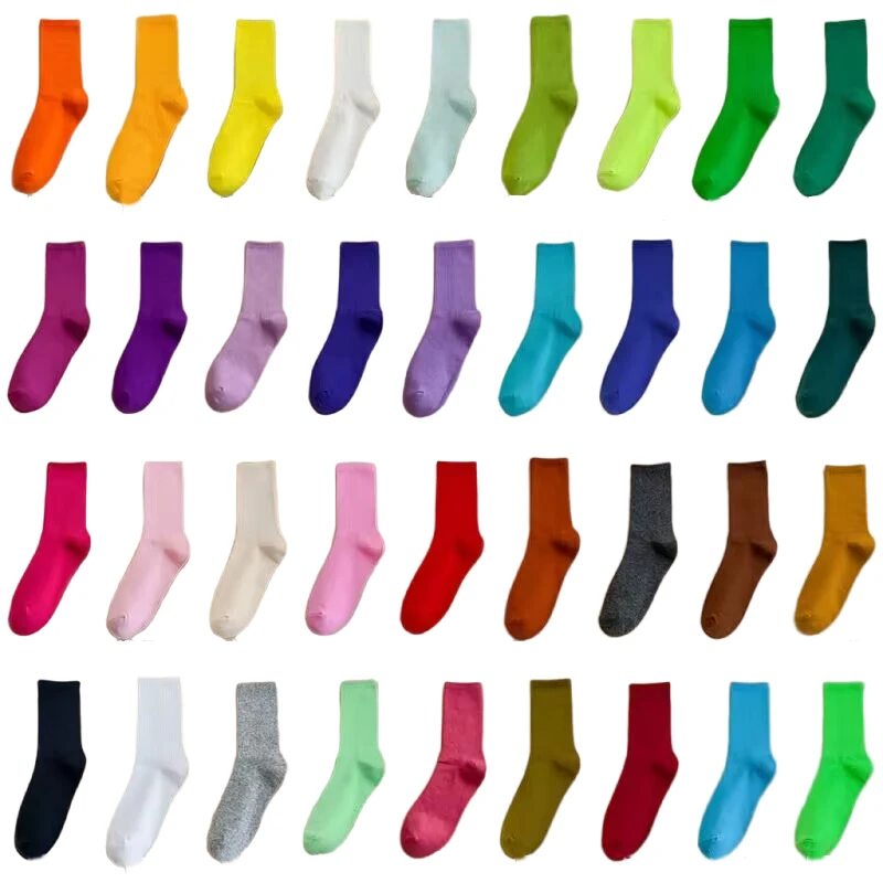 Collection of colorful socks in various shades on a white background