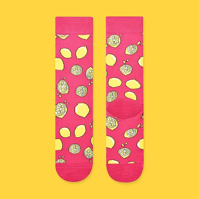 Pink socks with lemon pattern on a yellow background