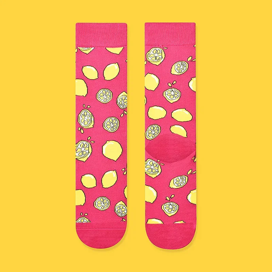 Pink socks with lemon pattern on a yellow background