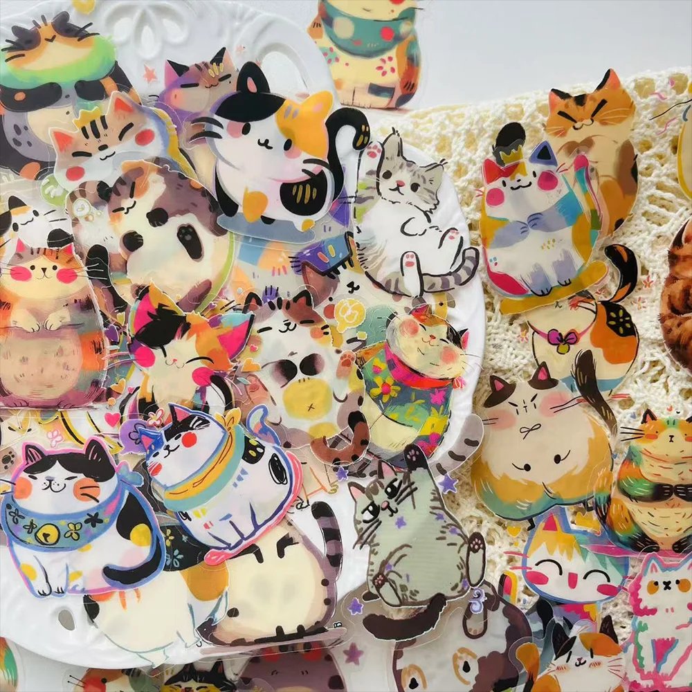Collection of colorful cat-themed stickers on a white background