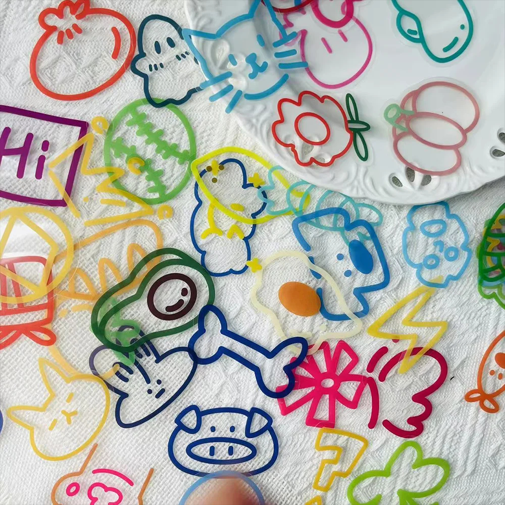 Colorful paper cutouts of various shapes and designs on a white background