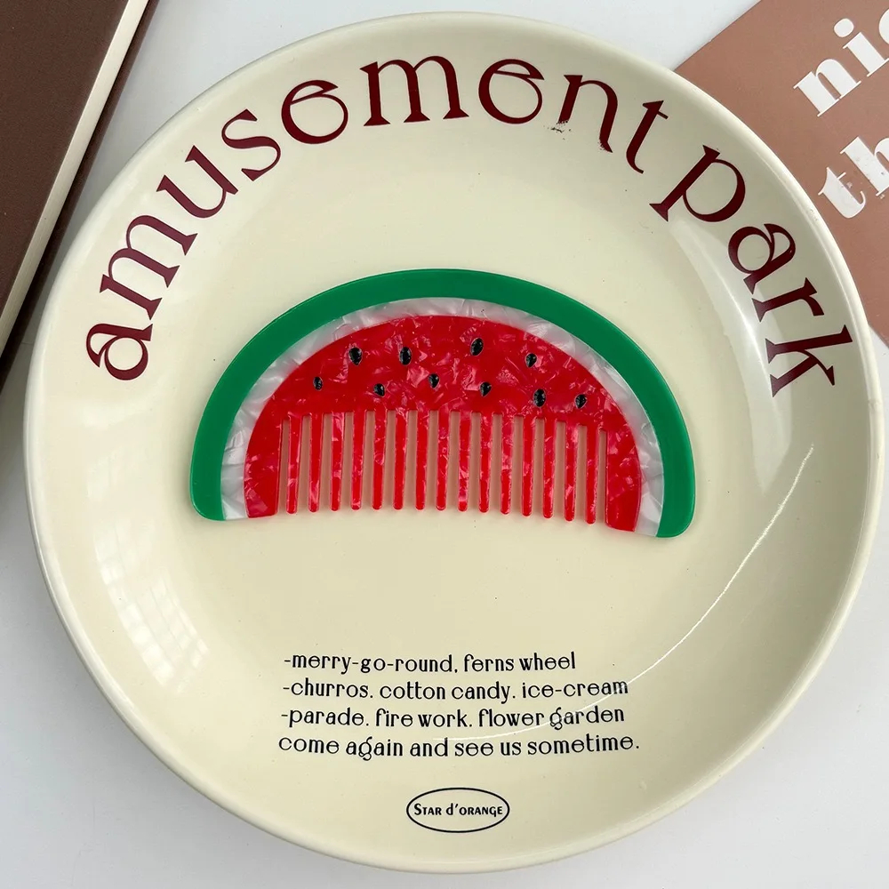 Decorative plate with a watermelon design and 'amusement park' text on a white background