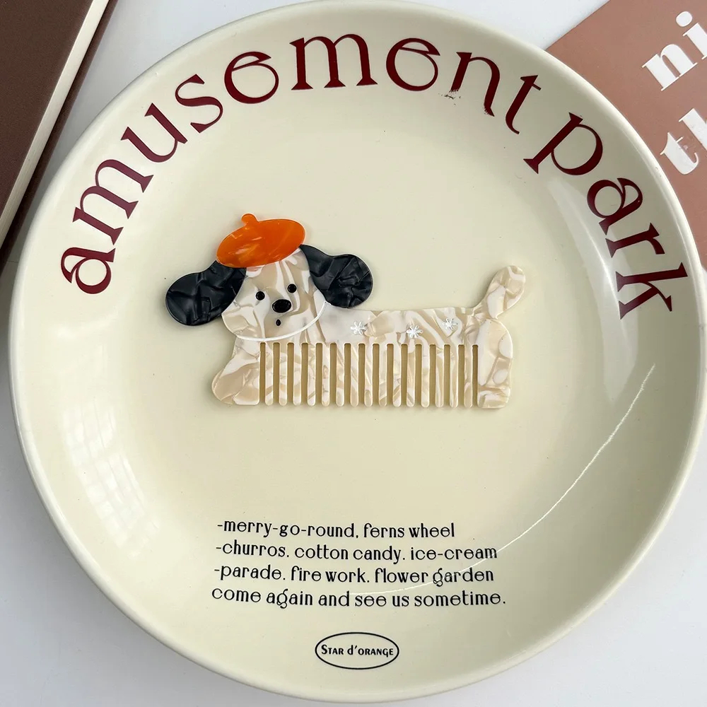 Decorative plate with a dog illustration and 'amusement park' text on a white background