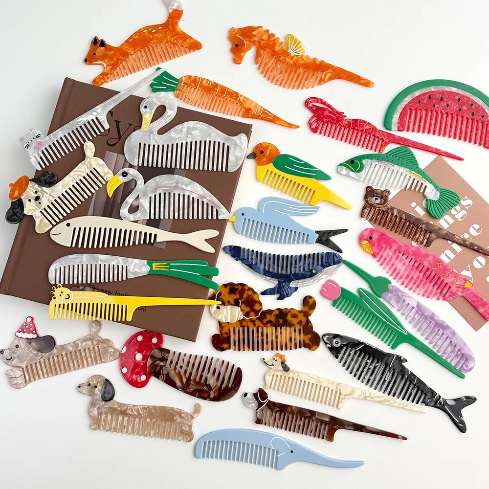 Collection of animal-themed combs on a white background
