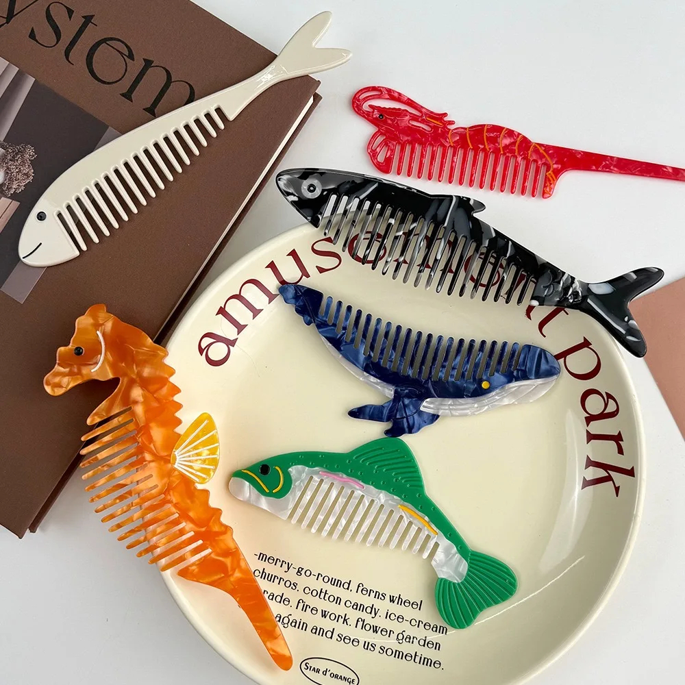Collection of novelty combs shaped like animals on a decorative plate with text.