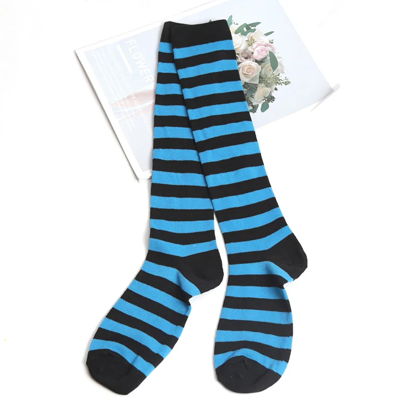 Black and blue striped knee-high socks on a white background
