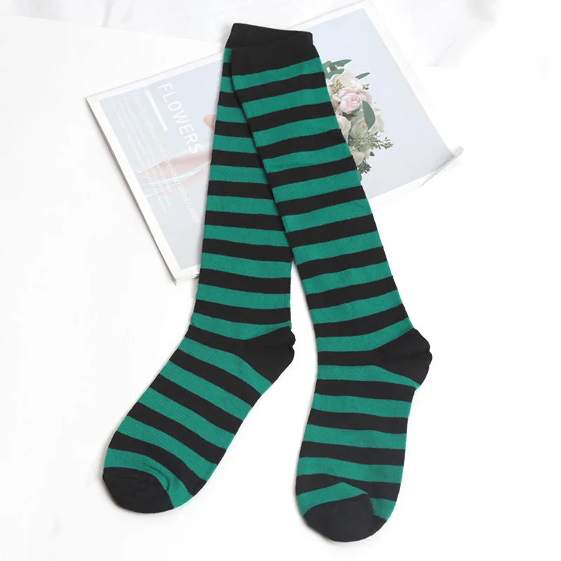 Green and black striped socks on a white background
