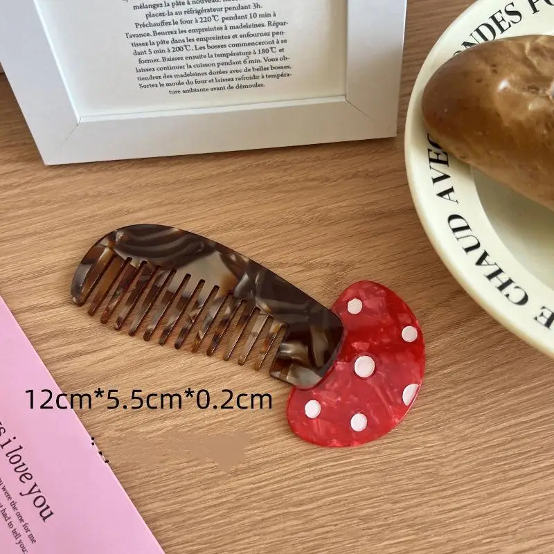 Tortoiseshell comb and red heart-shaped object on a wooden surface with text overlay.