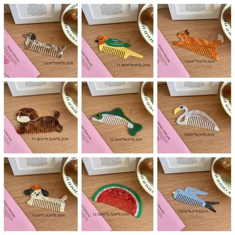 Collection of animal-themed combs on a wooden surface with measurements.