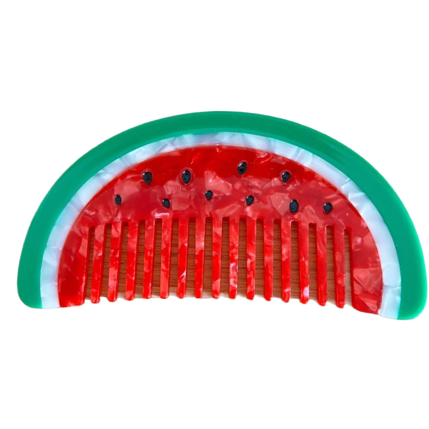 Watermelon-themed comb with red center, green rim, and black seeds on a white background
