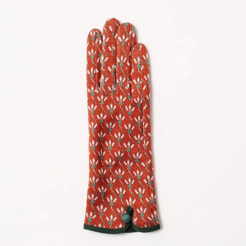 Red patterned glove on a white background