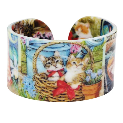 Cuff bracelet with cat-themed design featuring two kittens in a basket.