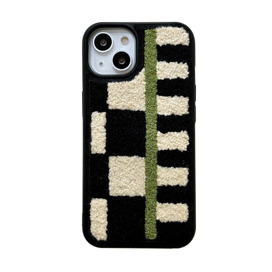 A black phone case featuring a textured geometric pattern with cream-colored blocks and a vertical olive green stripe, shown on a plain white background.