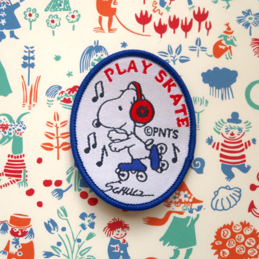 Rollerskating Snoopy from the Peanuts comic "Play Skate" embroidered patch badge appliqué