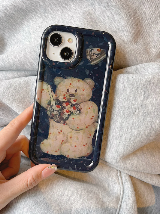 A cute iPhone cover with an illustration of a teddy bear eating a cherry cake on it.