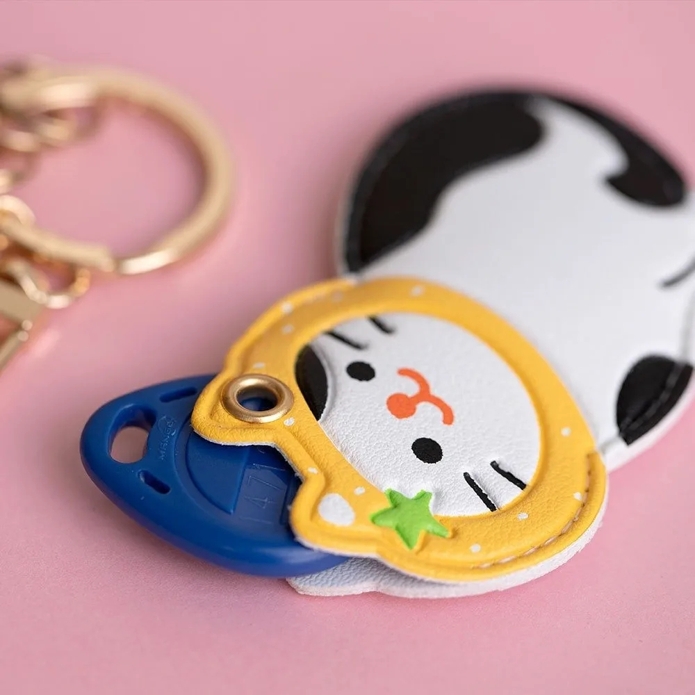 Keychain with cartoon character design on a pink background