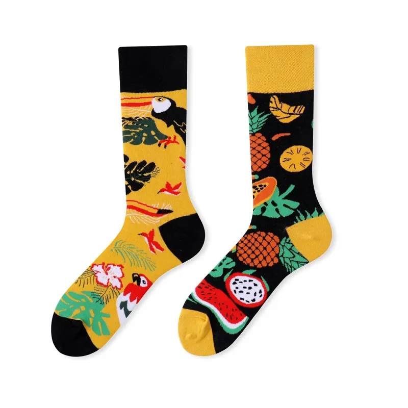 Two colorful socks with tropical designs on a white background