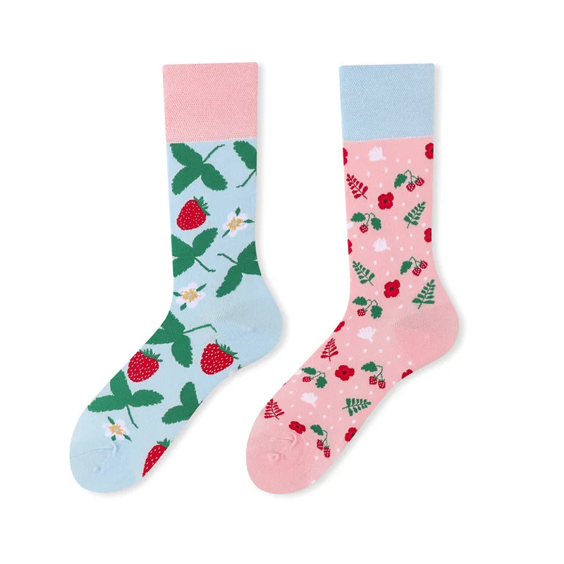 Two socks with strawberry pattern on a white background