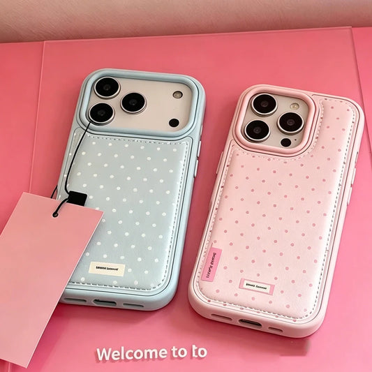 Two phone cases with polka dot pattern on a pink background