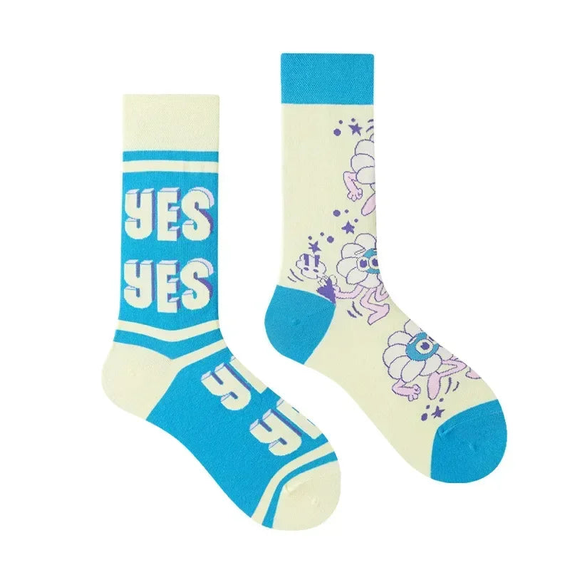 Pair of socks with 'YES' text and floral design on a white background