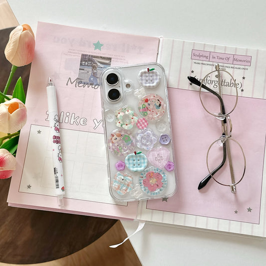 Phone case with decorative elements on a pink notebook with flowers and glasses.