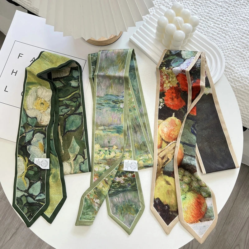 Three neckties with artistic designs on a white surface