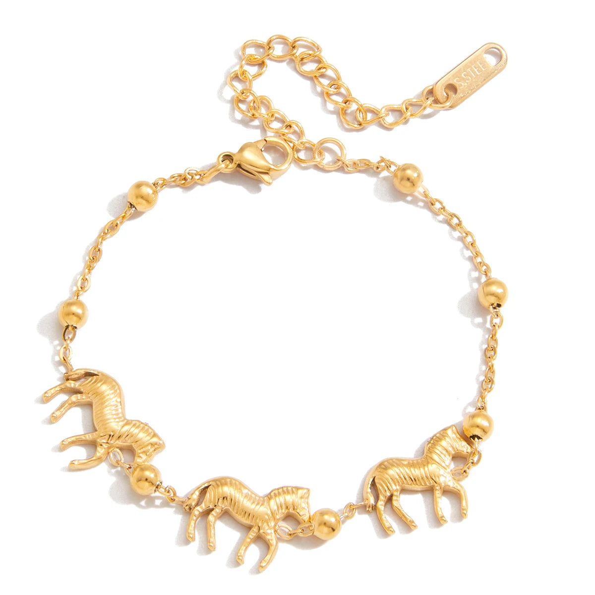 Gold bracelet with horse charms on a white background