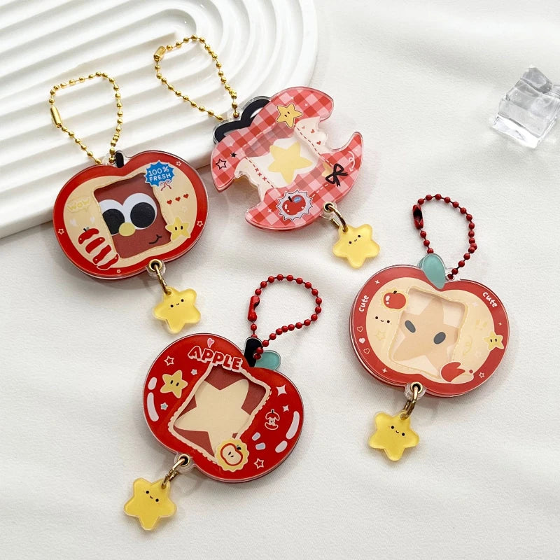 Four cartoon-themed keychains on a white surface