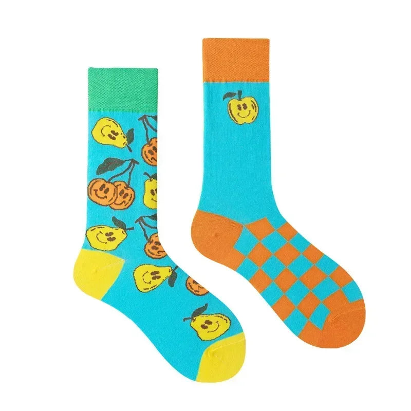 Colorful socks with fruit patterns on a white background