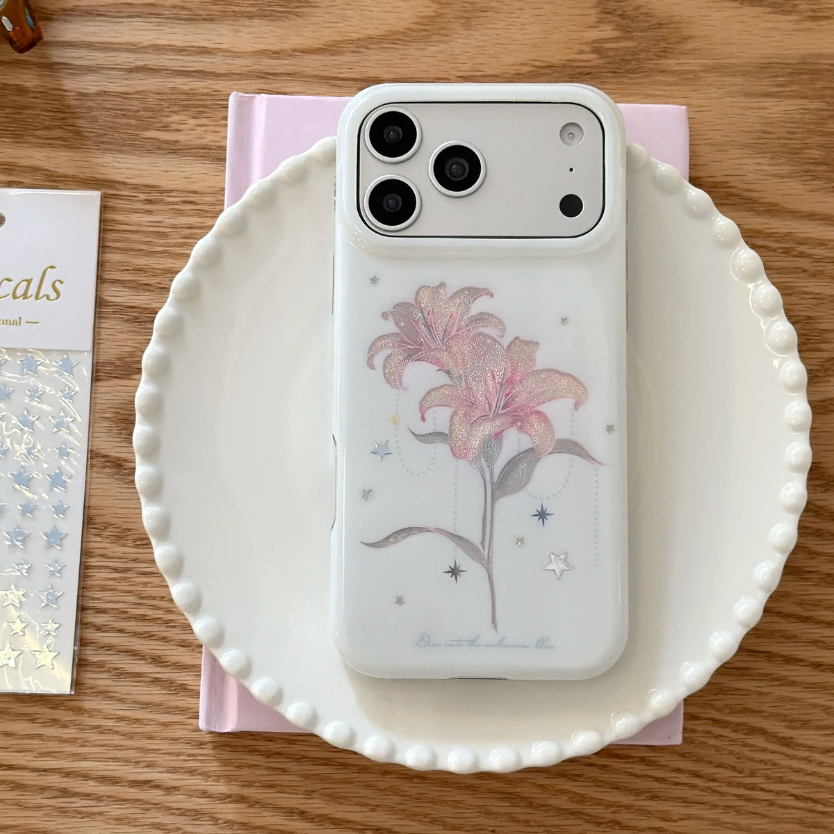 Phone case with floral design on a white plate