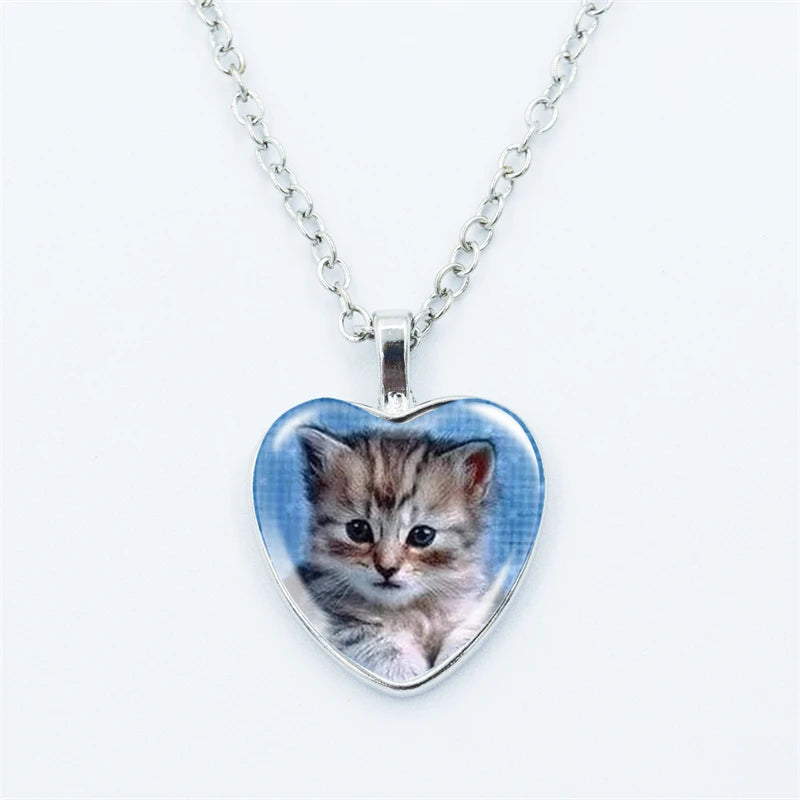 Heart-shaped pendant with a kitten picture on a white background