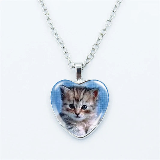 Heart-shaped pendant with a kitten picture on a white background