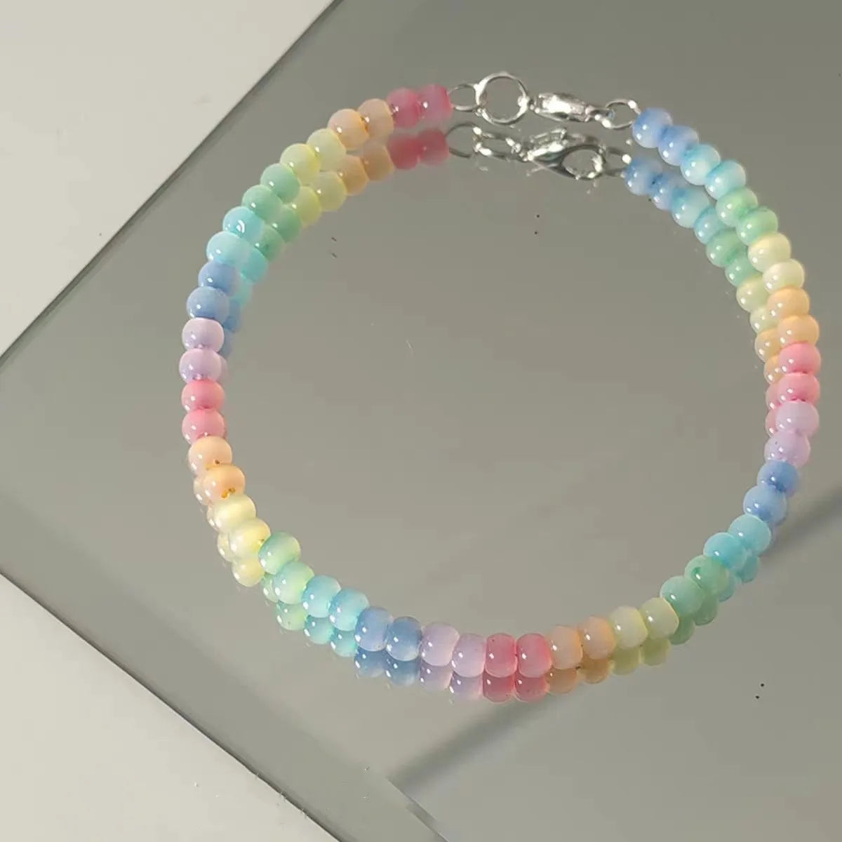 Multicolored beaded bracelet on a light gray surface