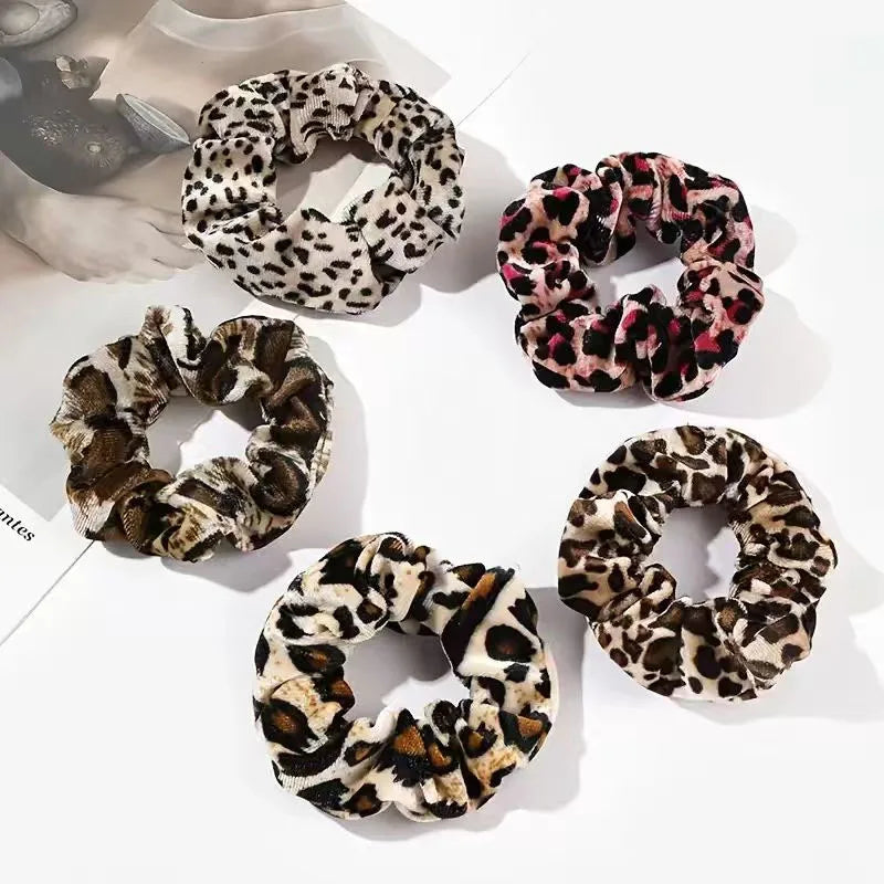 Set of leopard print scrunchies on a light background