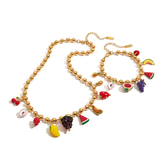 Necklace with fruit-themed charms on a white background