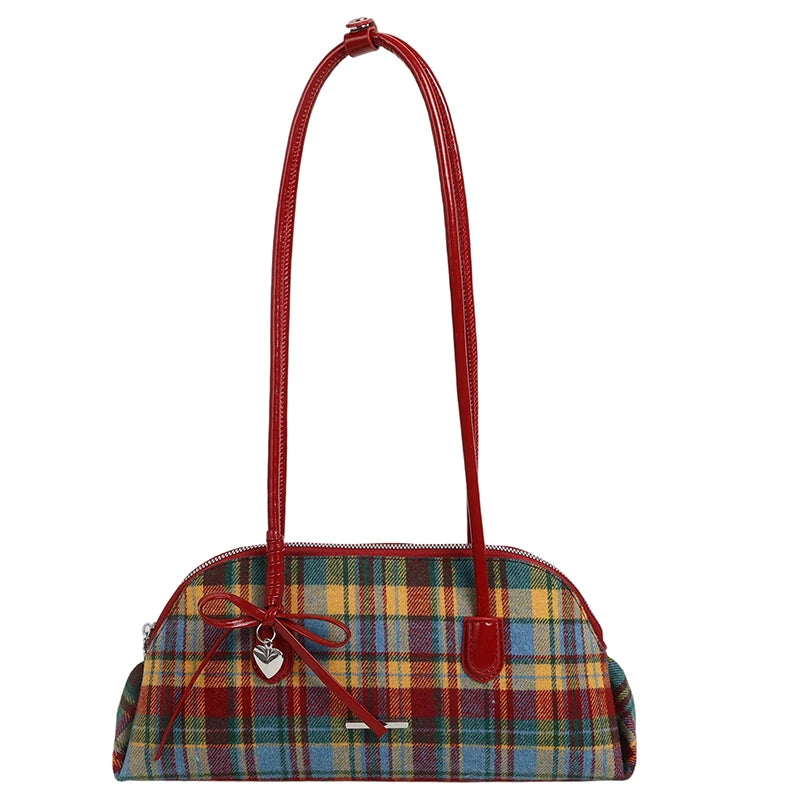 Plaid handbag with a red handle on a white background